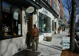 man walking into a store