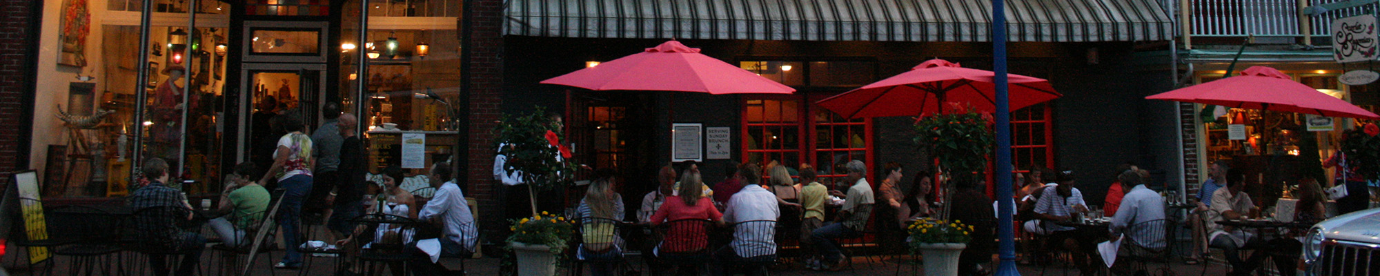 people dining outside of a restaurant